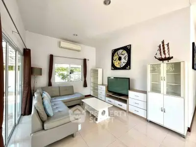Spacious living room with modern furniture and natural light
