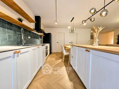 Modern kitchen with open layout and stylish lighting
