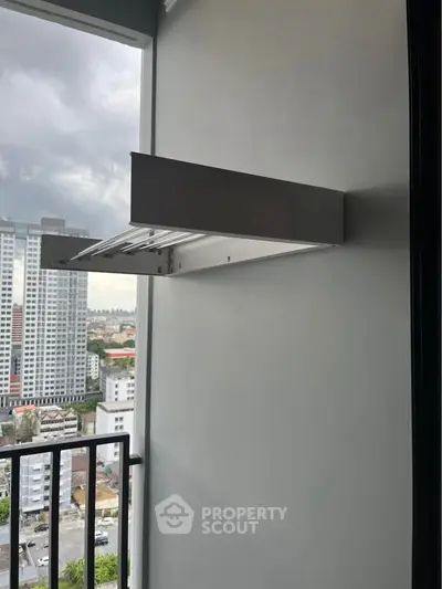 Modern balcony with city view in high-rise apartment