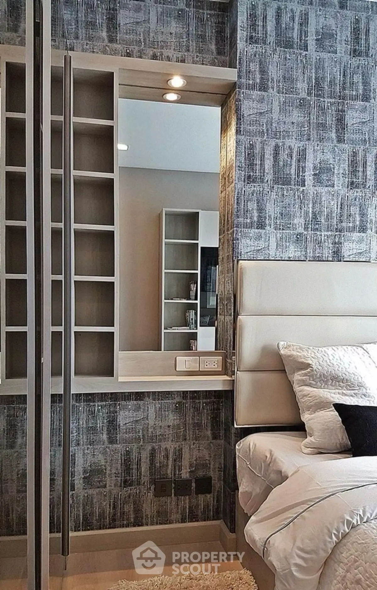Modern bedroom with stylish wallpaper and built-in shelving