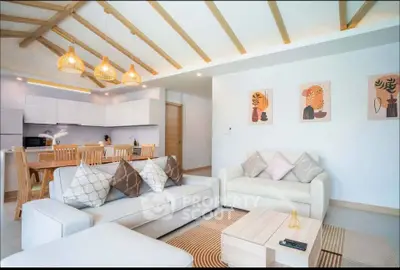 Spacious modern living room with open kitchen and stylish decor