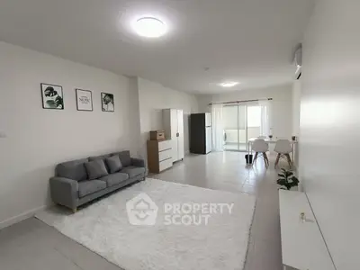 Spacious modern living room with elegant decor and natural light