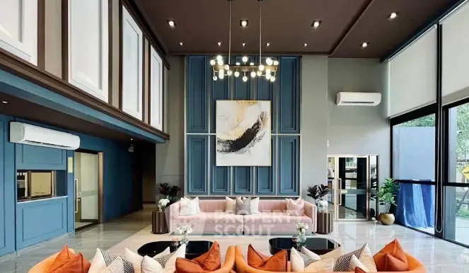 Luxurious modern living room with high ceilings, elegant decor, and stylish furniture in a spacious open layout.