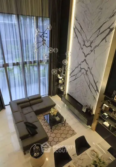 Luxurious modern living room with high ceilings and elegant decor