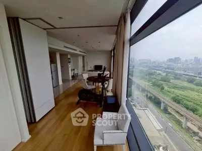 Spacious living room with panoramic city view and modern furnishings