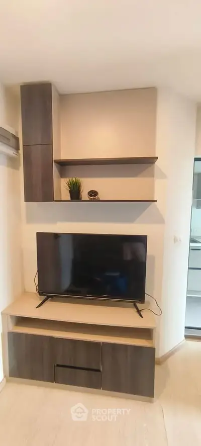 Modern living room with sleek TV unit and stylish shelving