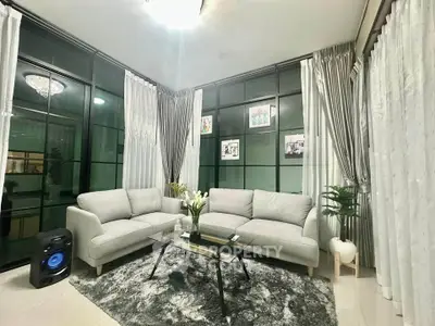 Stylish modern living room with elegant decor and large windows