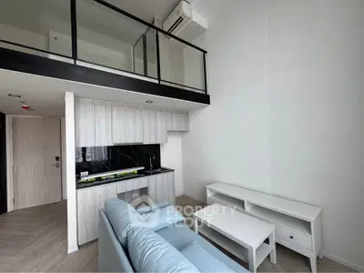 Modern loft apartment with sleek kitchen and cozy living area