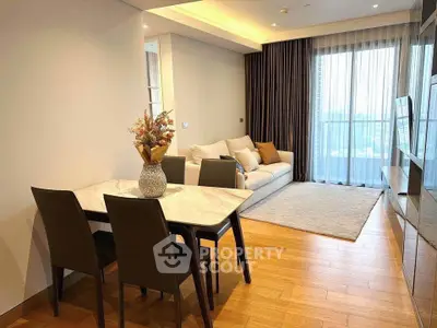 Modern living room with elegant dining area and large windows