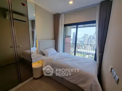 Modern bedroom with city view and stylish decor in high-rise apartment