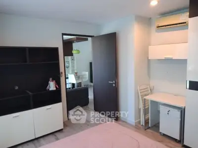 Modern studio apartment with sleek furniture, ample storage, and a cozy study nook, perfect for urban living and convenient work-from-home setup.