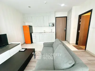 Modern living room with sleek kitchen and cozy sofa in stylish apartment