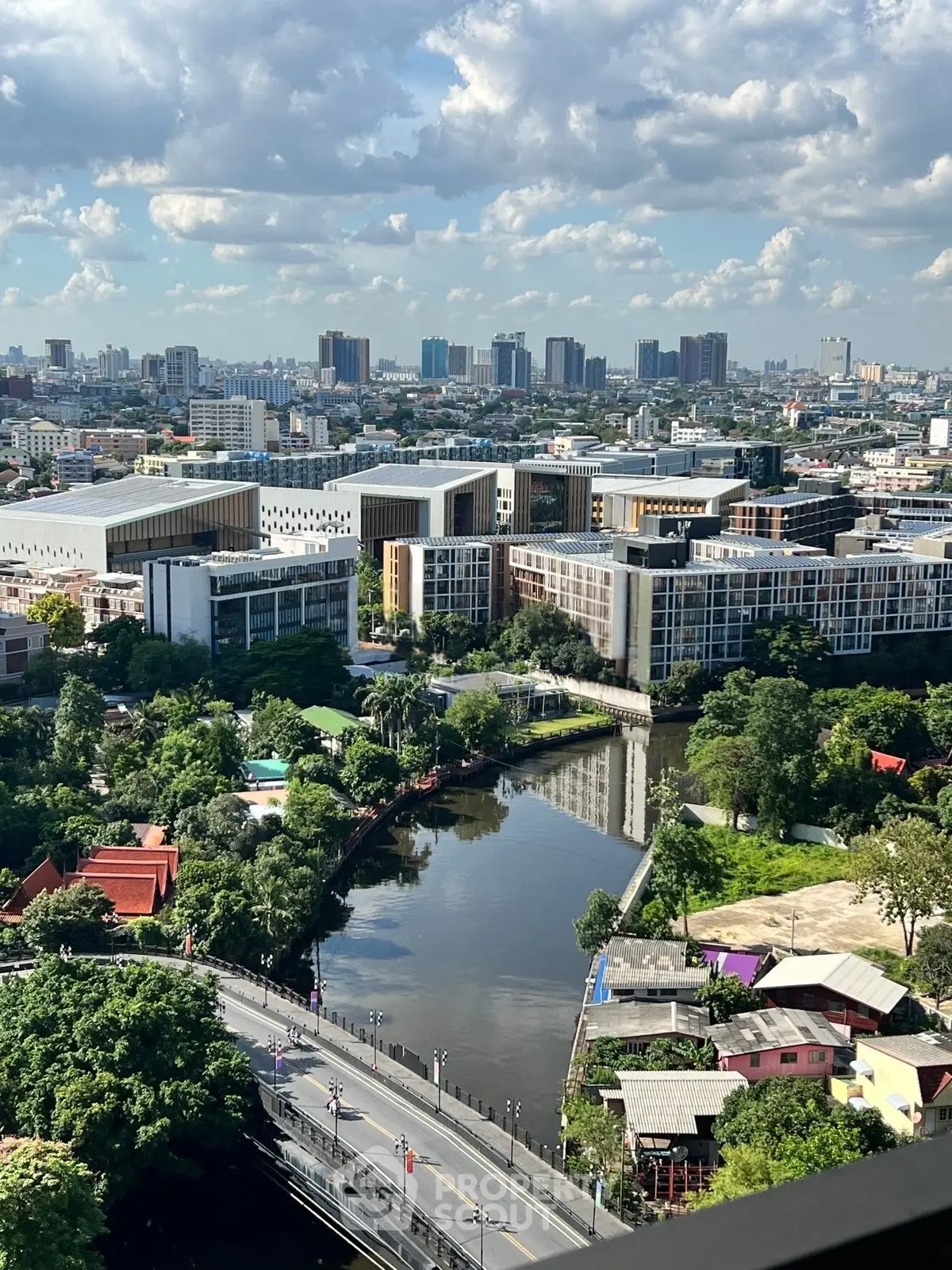 Stunning cityscape view with modern buildings and lush greenery, perfect for urban living enthusiasts.