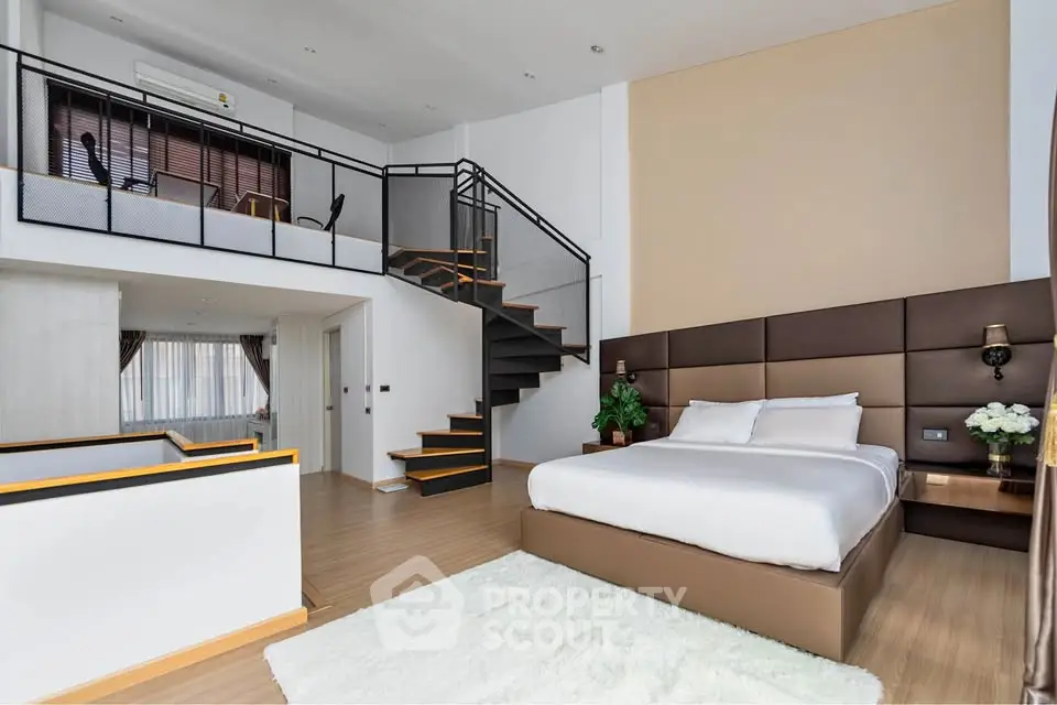 Luxurious modern bedroom with loft and elegant decor