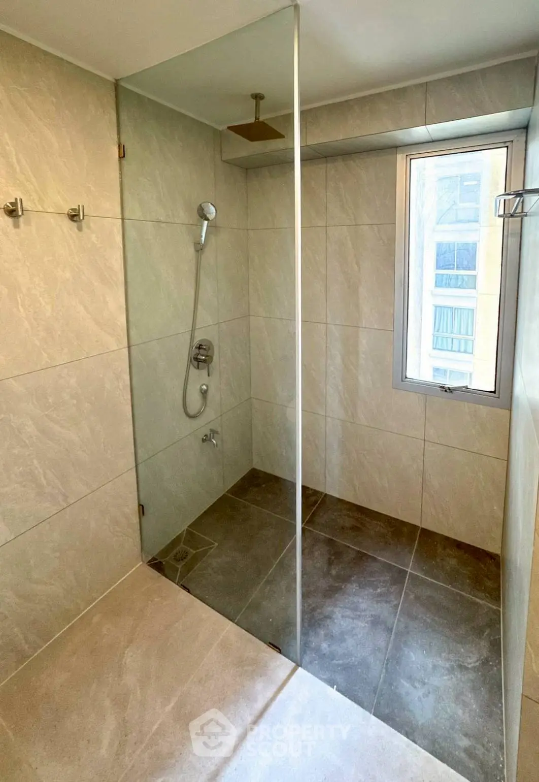 Modern bathroom with glass shower and natural light