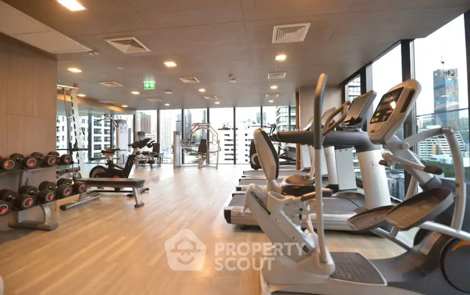 Modern gym with city view in luxury residential building