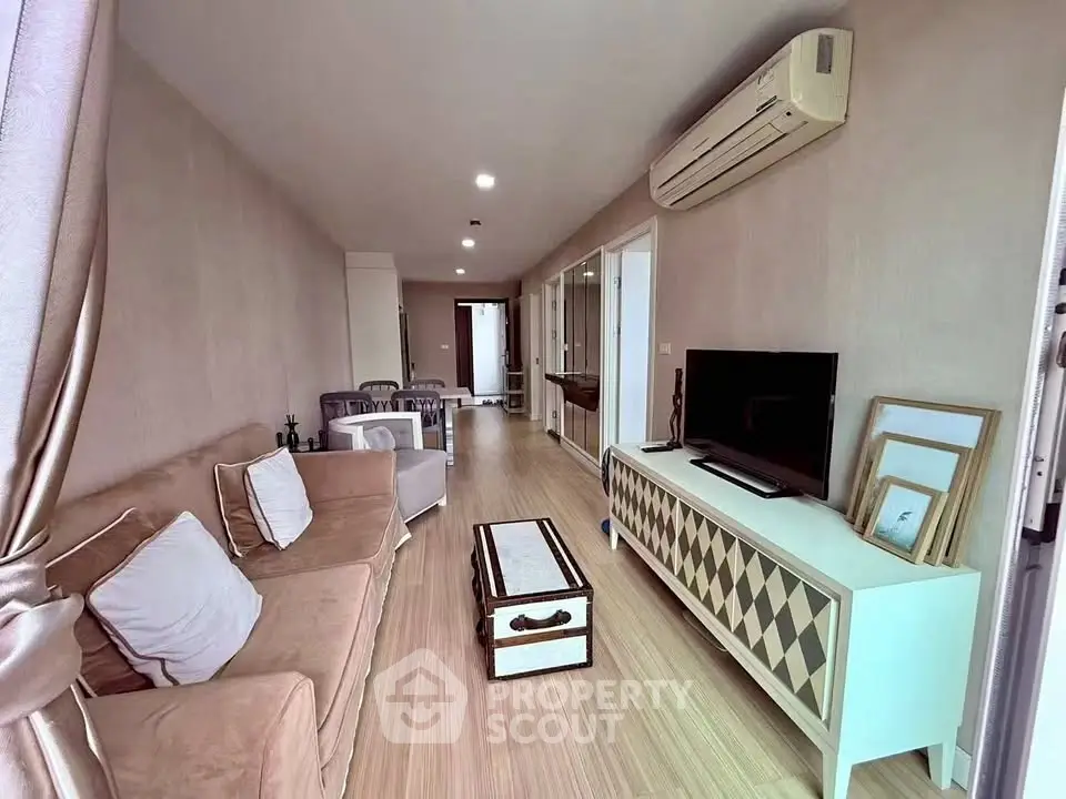 Spacious living room with modern decor and air conditioning