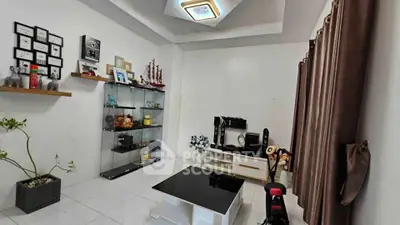 Modern living room with sleek decor and glass display cabinet