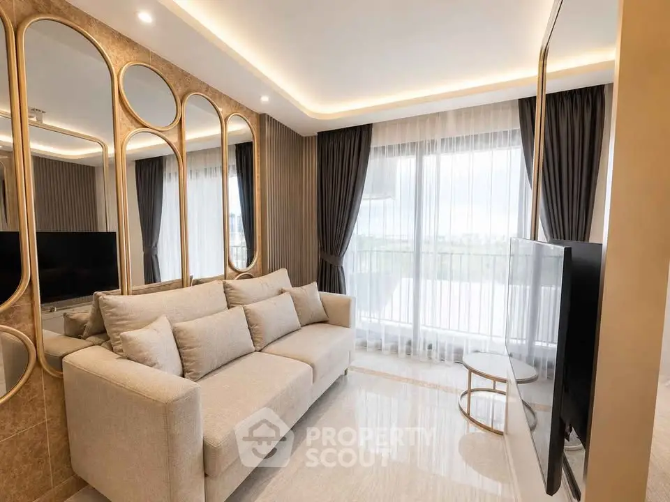 Luxurious living room with elegant decor and large windows offering natural light.