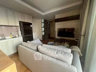Modern living room with cozy sofa and sleek entertainment center