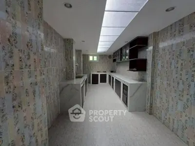 Spacious kitchen with unique tile design and ample counter space