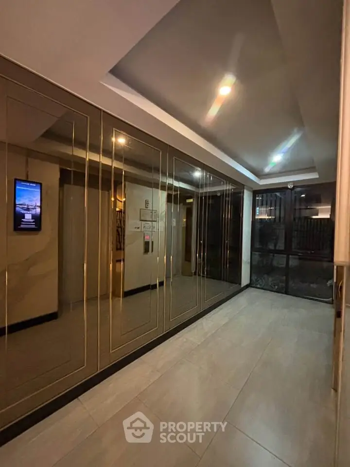 Elegant building entrance with modern lighting and sleek design
