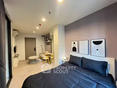 Modern studio apartment with stylish decor and cozy living area, perfect for urban living.
