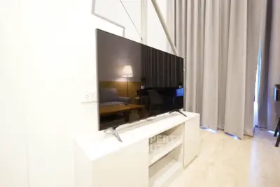 Modern living room with sleek TV setup and elegant decor
