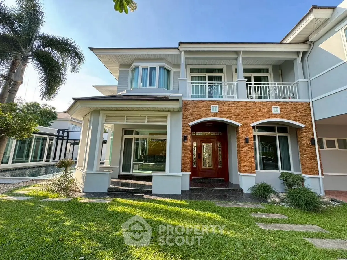 Elegant two-story house with lush garden and modern design