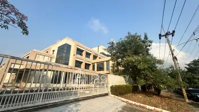 Modern commercial building with unique architecture and spacious surroundings, ideal for business opportunities.