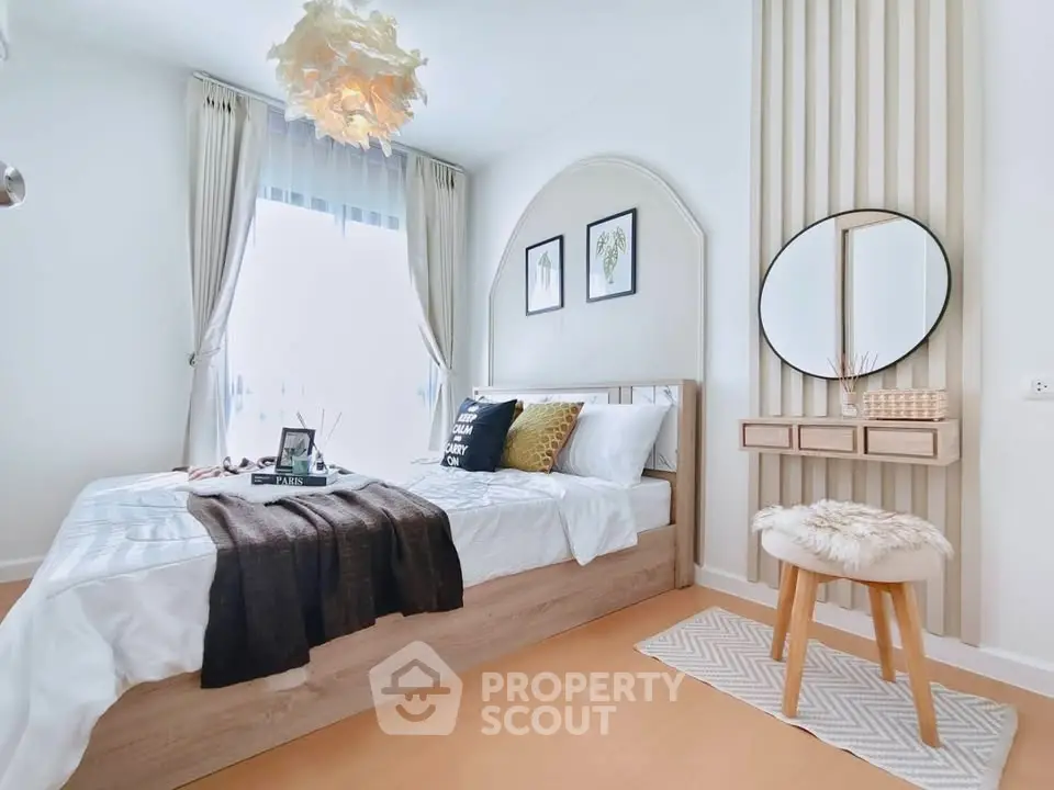 Chic and cozy bedroom with modern decor and natural light