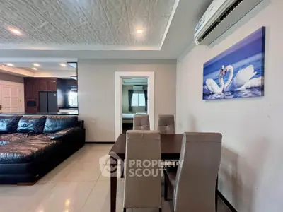 Modern living room with elegant dining area and stylish decor