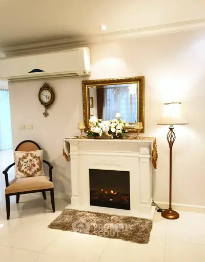 Elegant living room with fireplace, classic decor, and cozy ambiance.