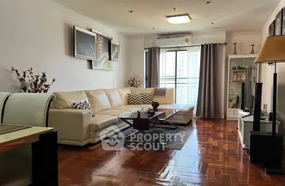 Spacious living room with elegant decor and large windows for natural light.