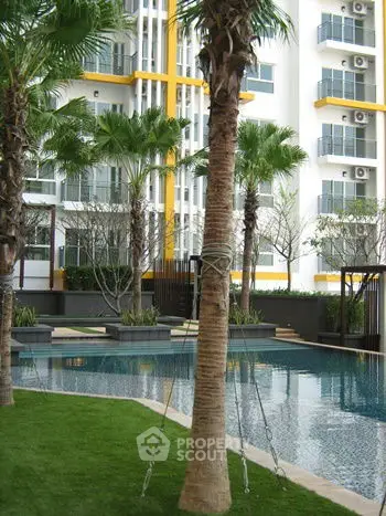 Luxurious condominium with stunning pool and lush greenery