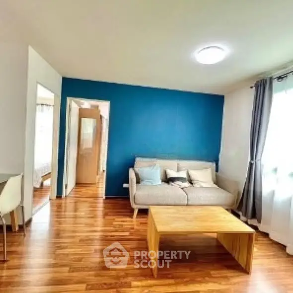 Bright living room with wooden flooring and modern furniture