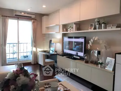 Modern living room with stylish decor and balcony view