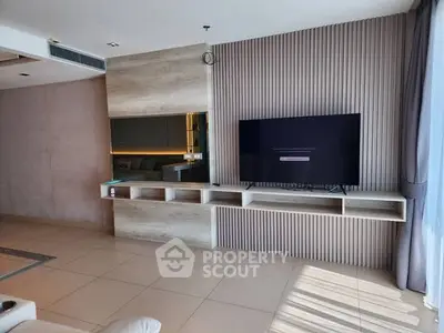 Modern living room with sleek TV setup and stylish wall design