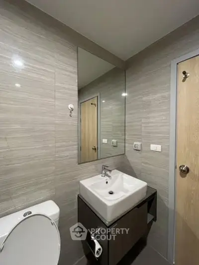 Modern bathroom with sleek fixtures and neutral tones