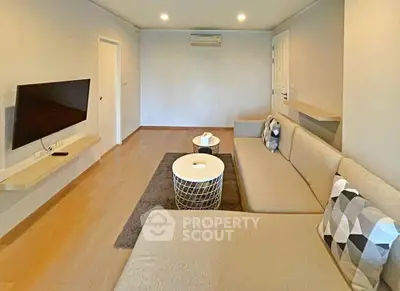 Spacious modern living room with sleek design and comfortable seating