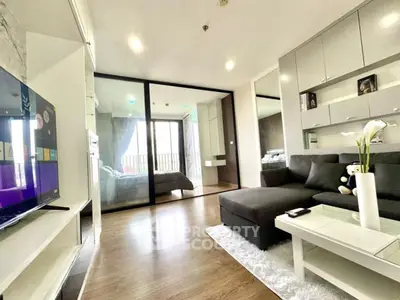 Modern living room with sleek design and cozy ambiance, featuring a spacious layout and stylish decor.