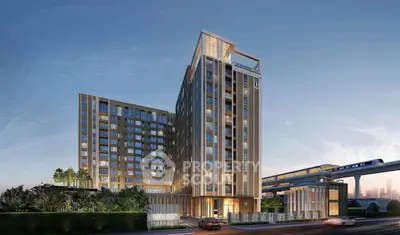 Modern high-rise building with sleek design near public transportation, ideal for urban living.