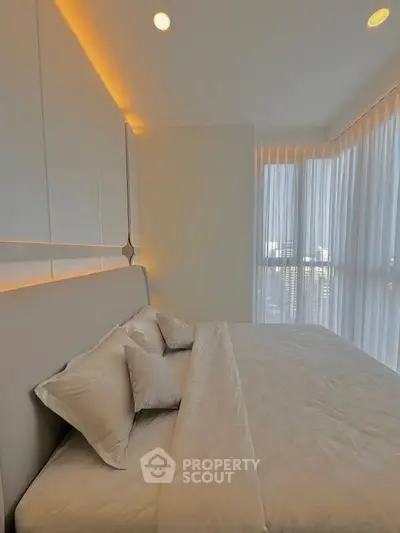 Luxurious bedroom with elegant lighting and panoramic city view