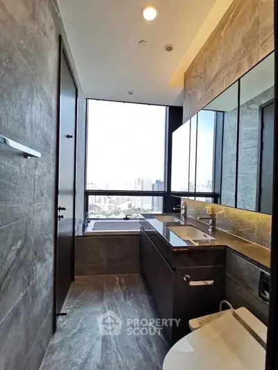 Luxurious bathroom with city view, featuring dual sinks and modern design.