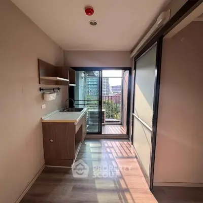 Modern kitchen with open layout and balcony view