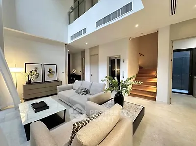 Luxurious modern living room with high ceilings and elegant decor