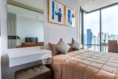 Modern bedroom with city view, stylish decor, and natural light in high-rise apartment.