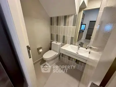 Modern bathroom with sleek design and contemporary fixtures in a stylish home.