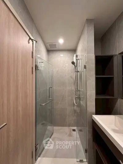 Modern bathroom with glass shower enclosure and sleek design