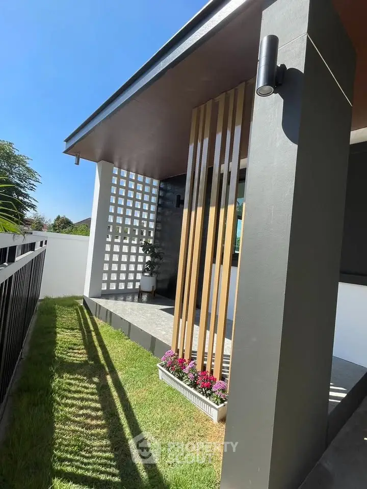 Modern home exterior with sleek design and landscaped garden